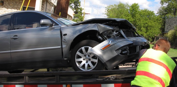 officer with a dent car
